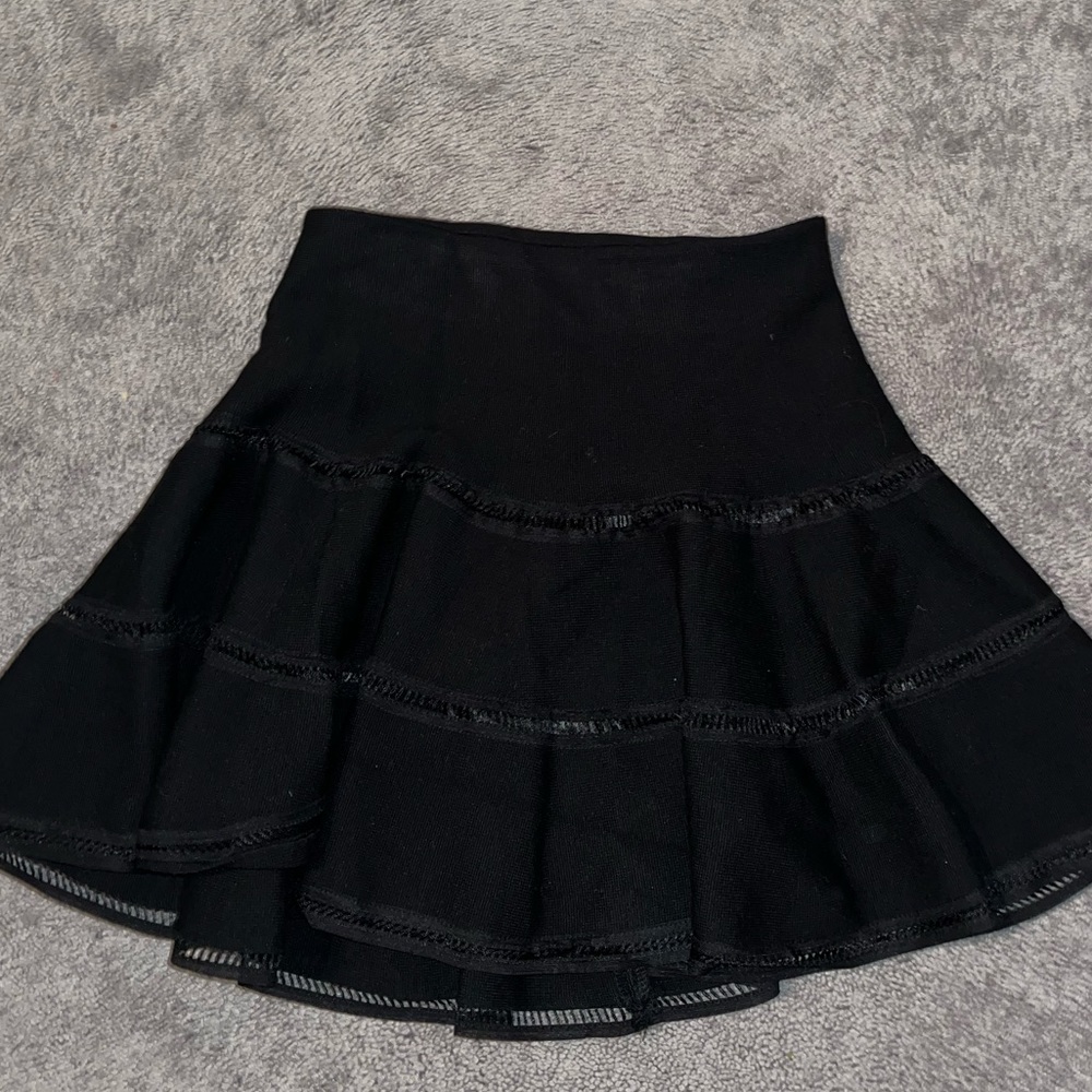 Black flared mini skirt with cut out detailing